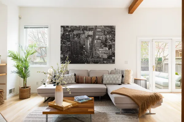 a living room with furniture and a large window