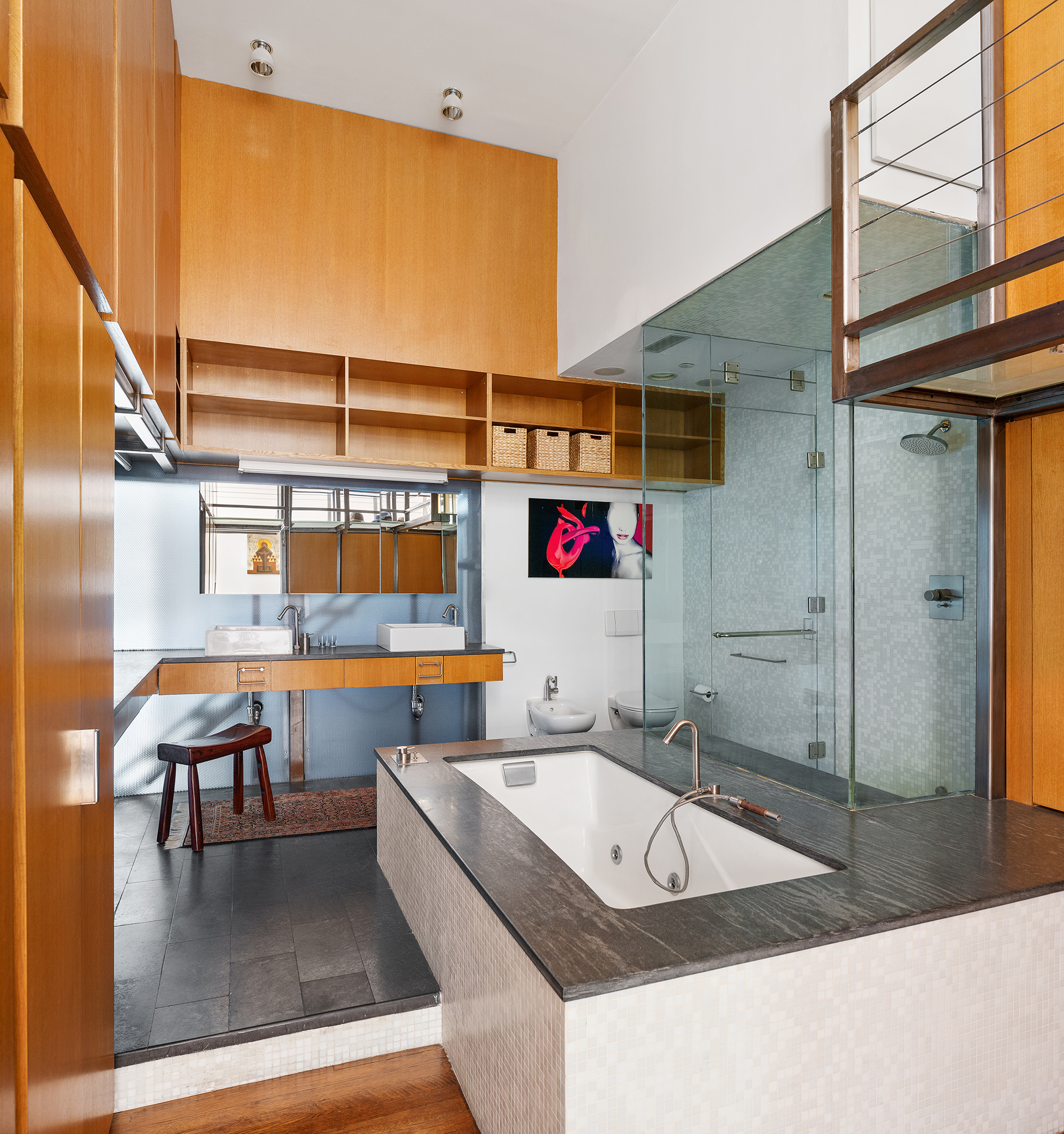 84 Mercer Street, Unit 3E Manhattan, NY 10012 - Photo 14 of 19 a bathroom with a granite countertop sink and a large mirror