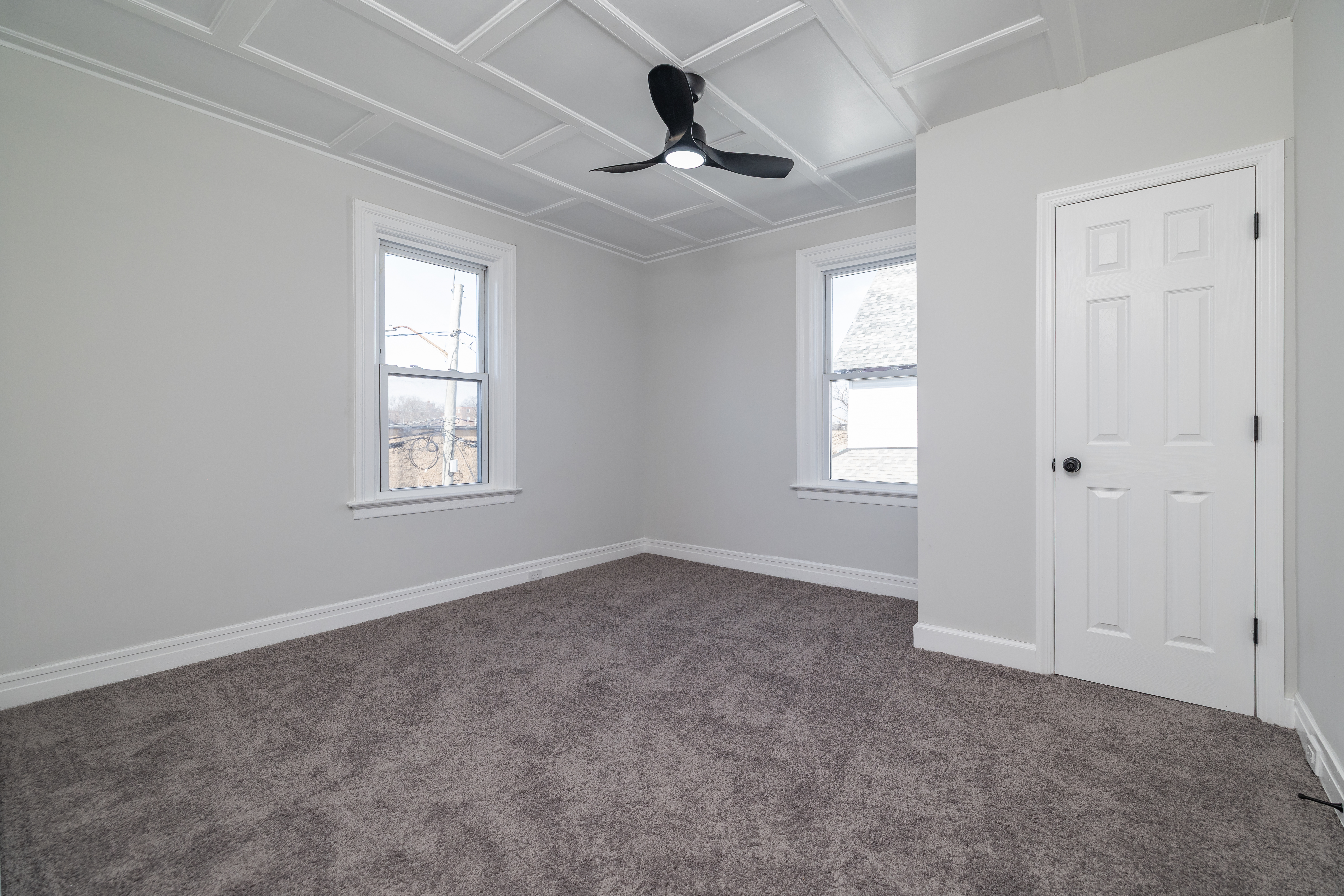 13-03 Brunswick Avenue Queens, NY 11691 - Photo 16 of 27 an empty room with windows and fan