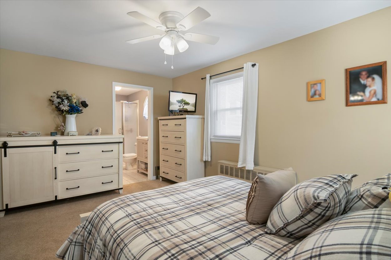 107 Kingston Road Parsippany, NJ 07054 - Photo 20 of 43 a bedroom with a bed and a dresser