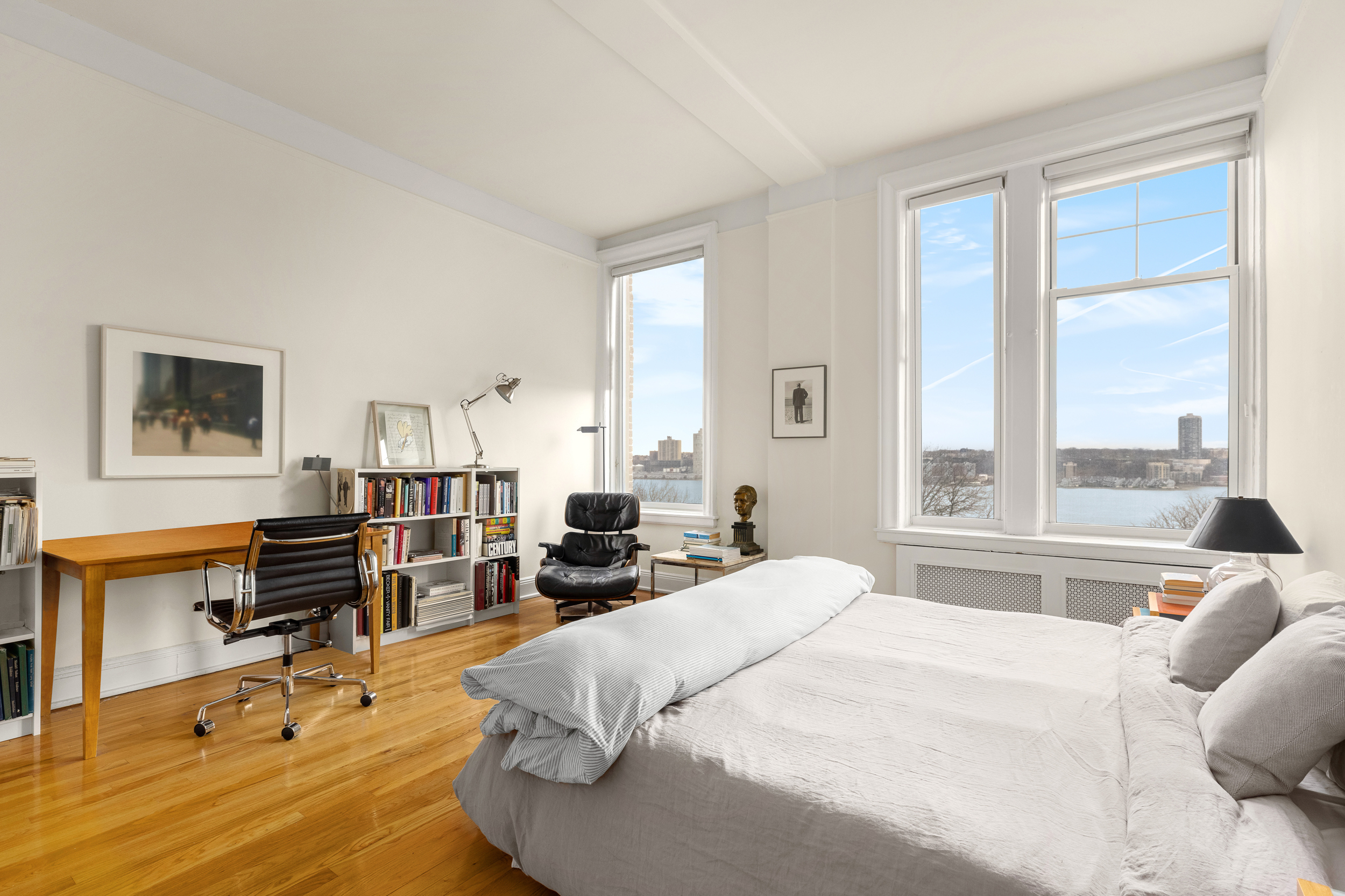 155 Riverside Drive, Unit 6B Manhattan, NY 10024 - Photo 5 of 8 a bedroom with a bed and wooden floor