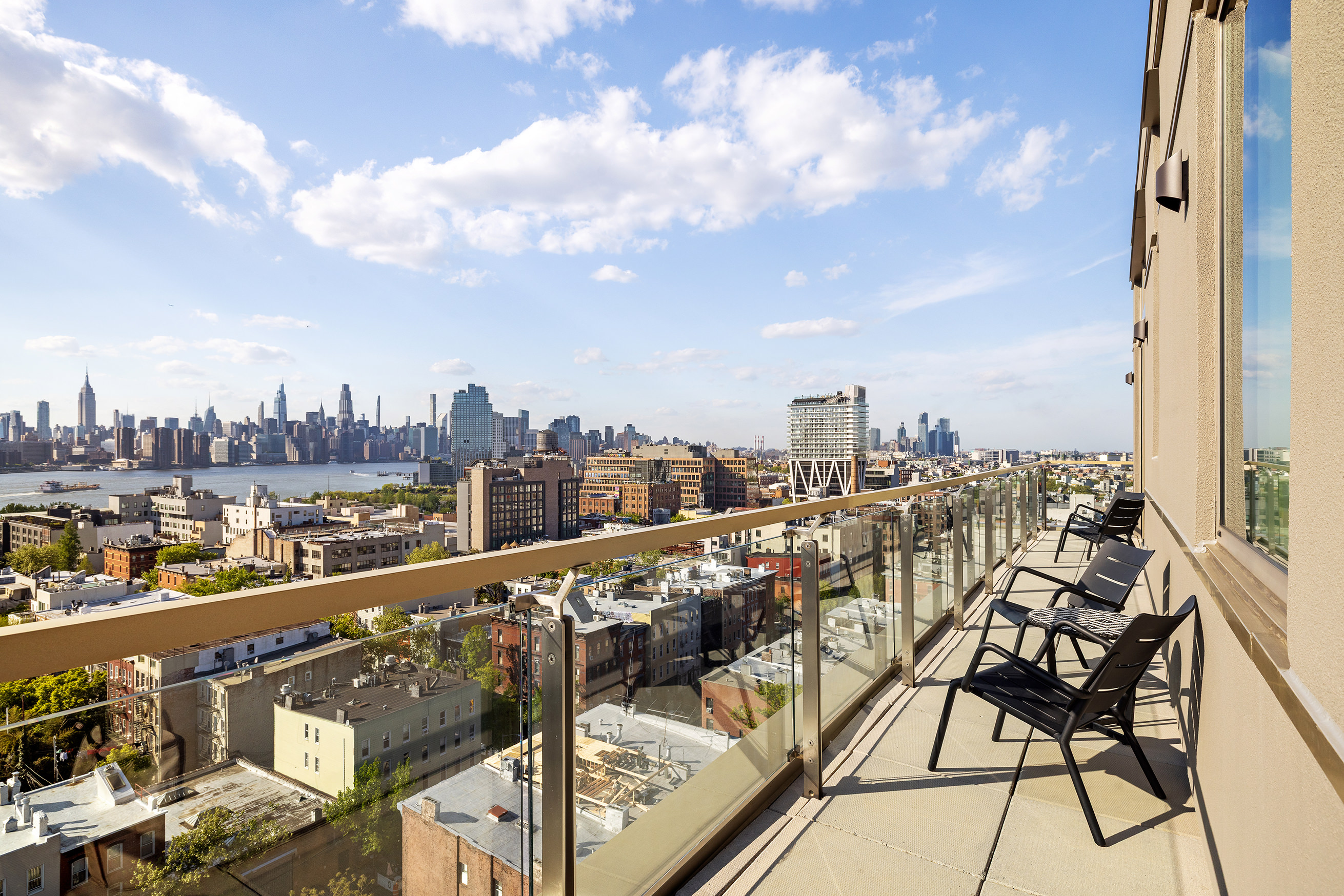 144 North 8th Street, Unit 12A Brooklyn, NY 11249 - Photo 3 of 21 a view of a city from a balcony