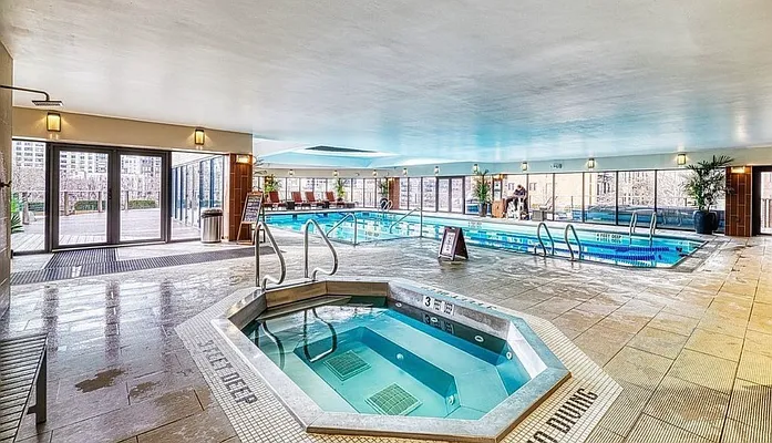 330 East 38th Street, Unit 20E Manhattan, NY 10016 - Photo 13 of 17 a swimming pool with outdoor seating and yard