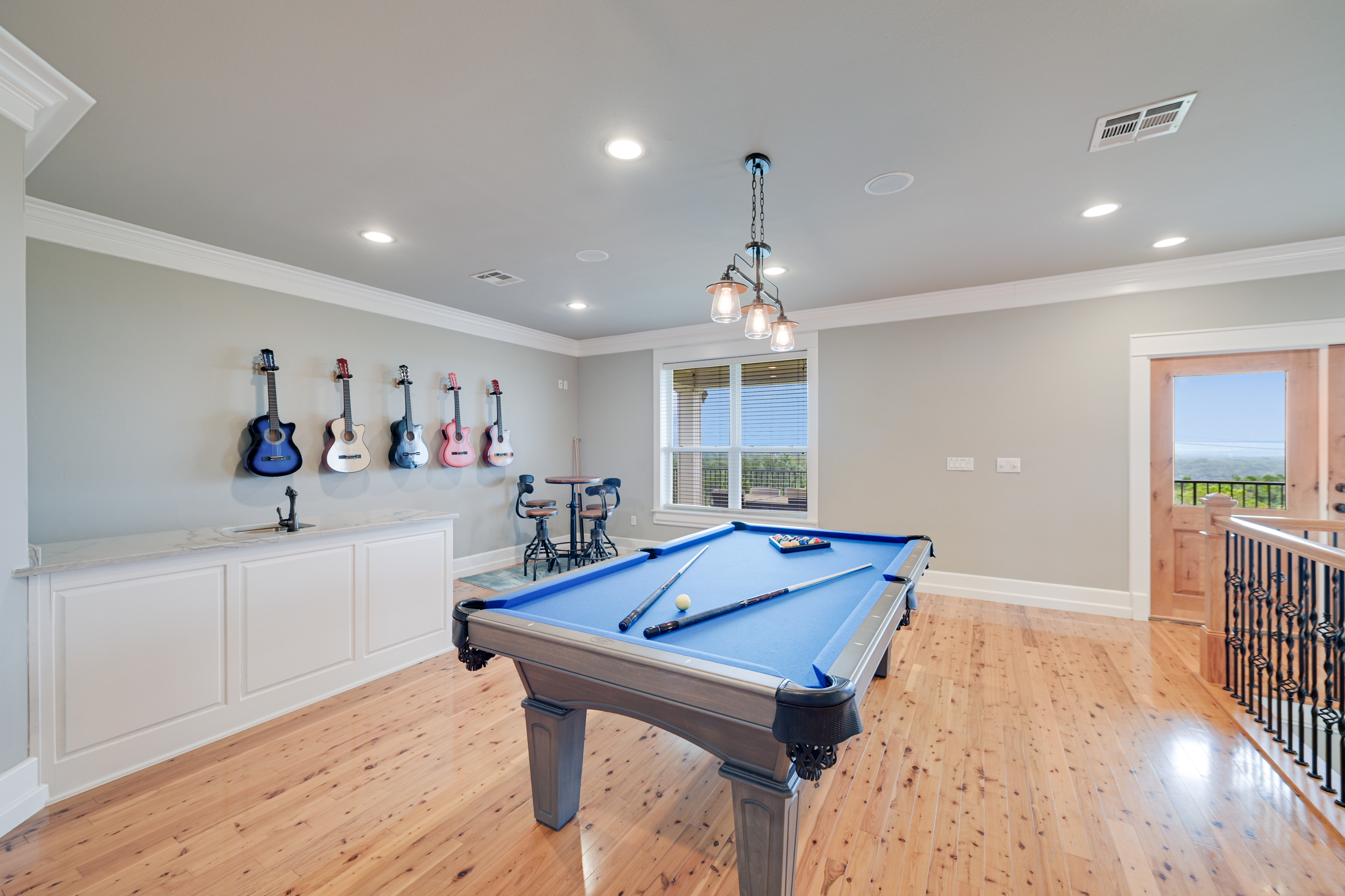14913 Murfin Road Austin, TX 78734 - Photo 14 of 40 a room with pool table and wooden floor