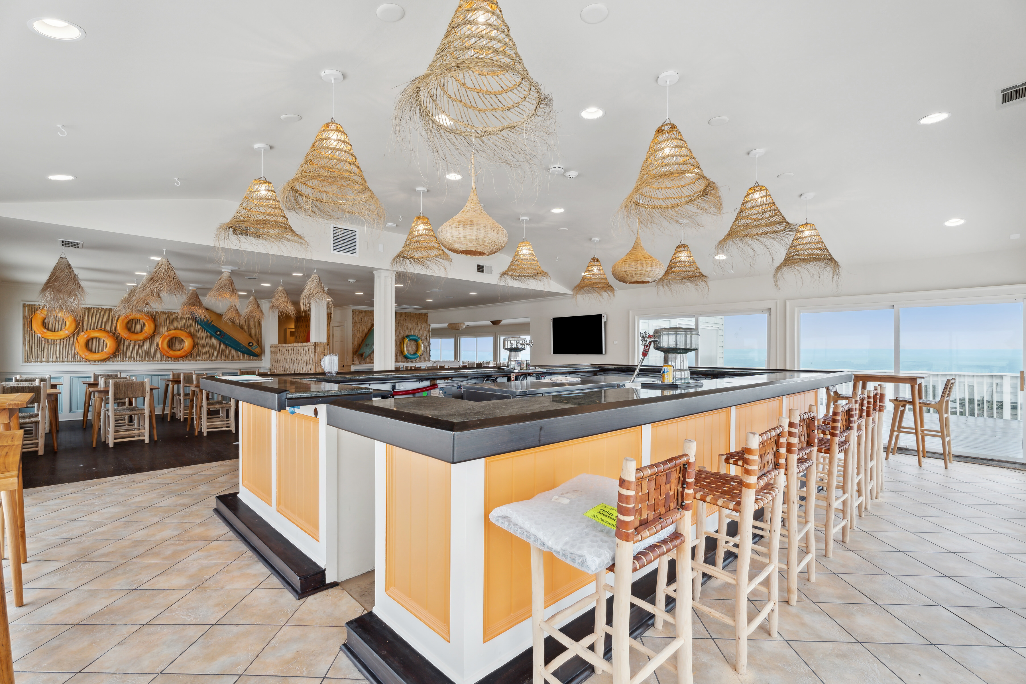 363 Beach Road Hampton Bays, NY 11959 - Photo 18 of 26 a kitchen with stainless steel appliances granite countertop a stove and a view of living room