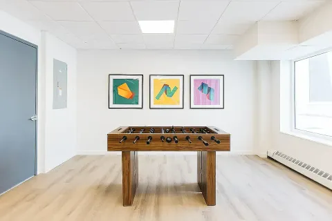 a room with furniture and wall paintings