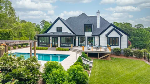 a front view of house with yard and outdoor seating