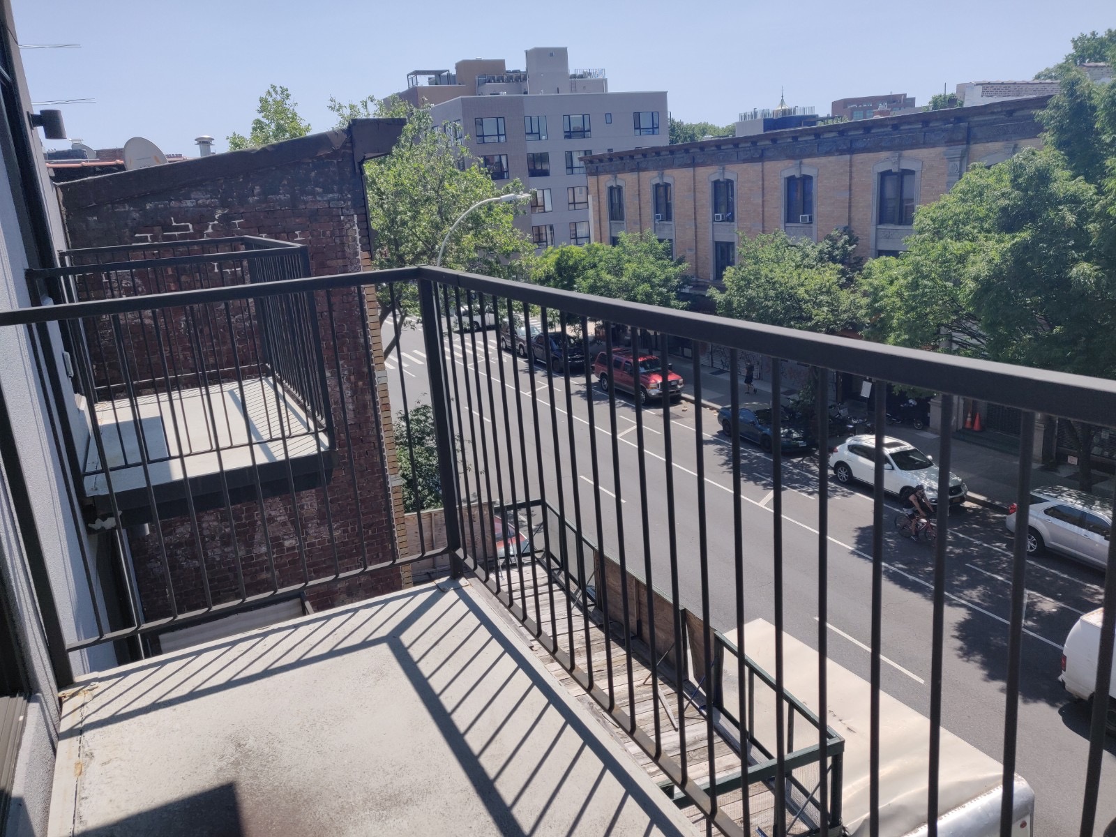 1149 Bedford Avenue, Unit 4A Brooklyn, NY 11216 - Photo 8 of 9 a view of a balcony with wooden floor and city view