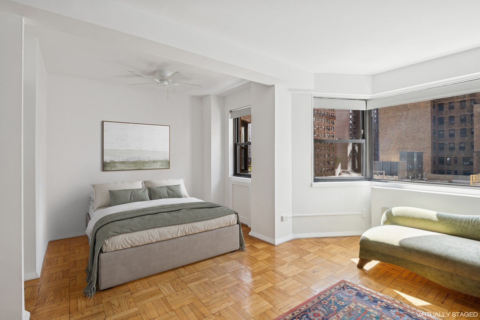 305 East 72nd Street, Unit 10G Manhattan, NY 10021 - Photo 2 of 6 a bedroom with furniture and a couch