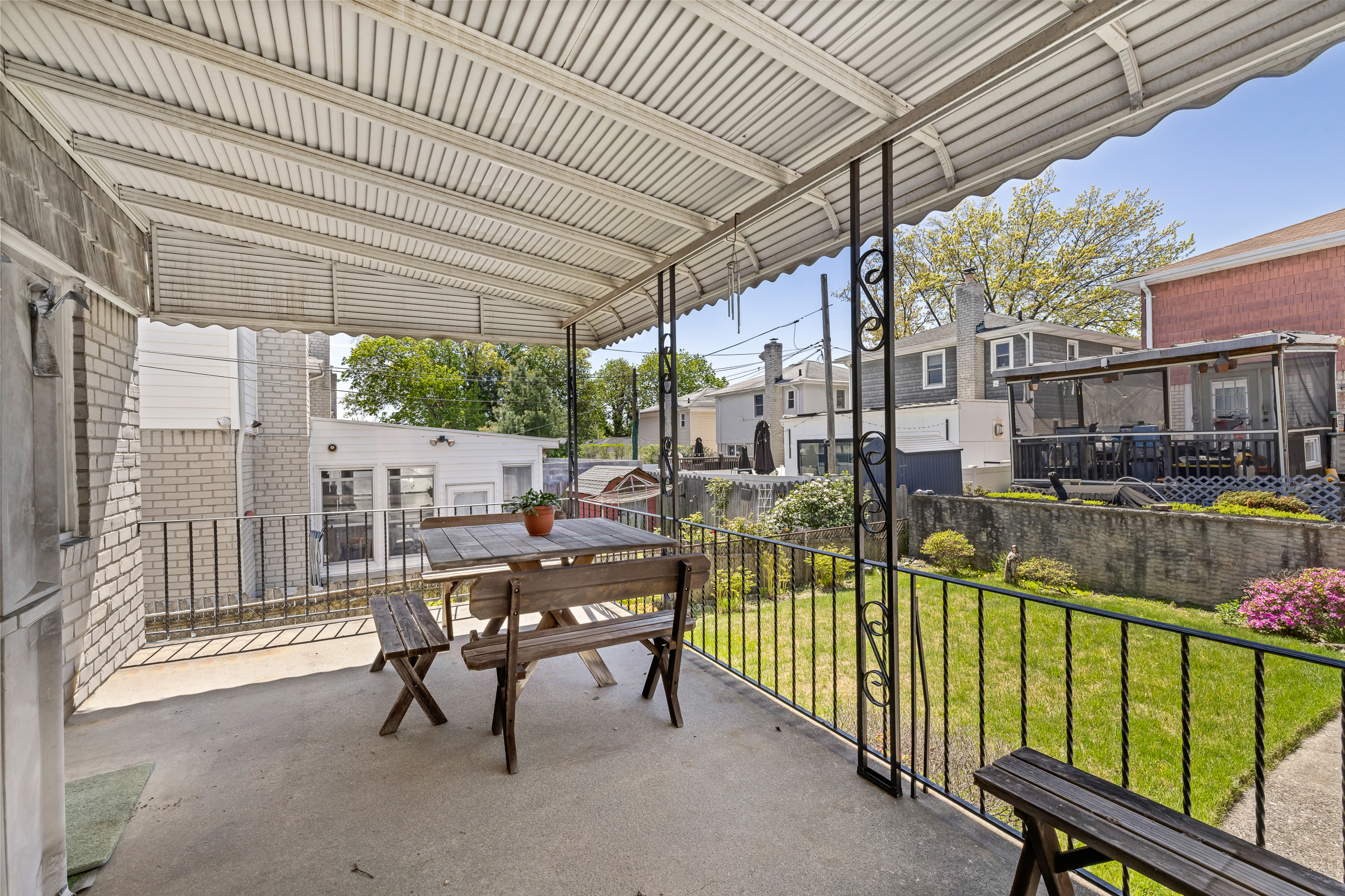 14-28 140th Street Queens, NY 11357 - Photo 12 of 14 a view of a porch with chairs