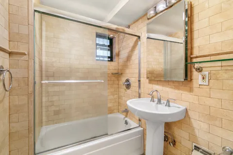 a bathroom with a bathtub and a sink