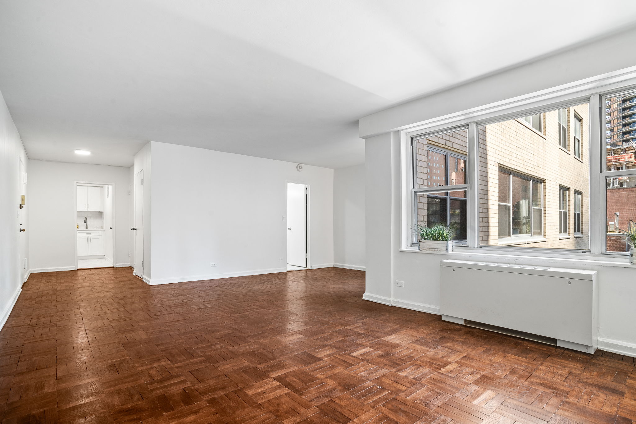 150 East 61st Street, Unit 8B Manhattan, NY 10065 - Photo 6 of 30 a view of an empty room with a window