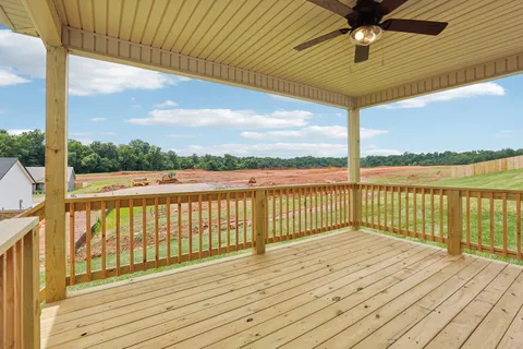 a view of balcony with wooden floor