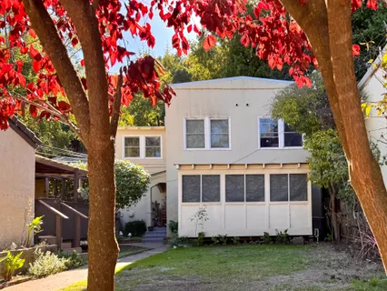 a house with trees in the background