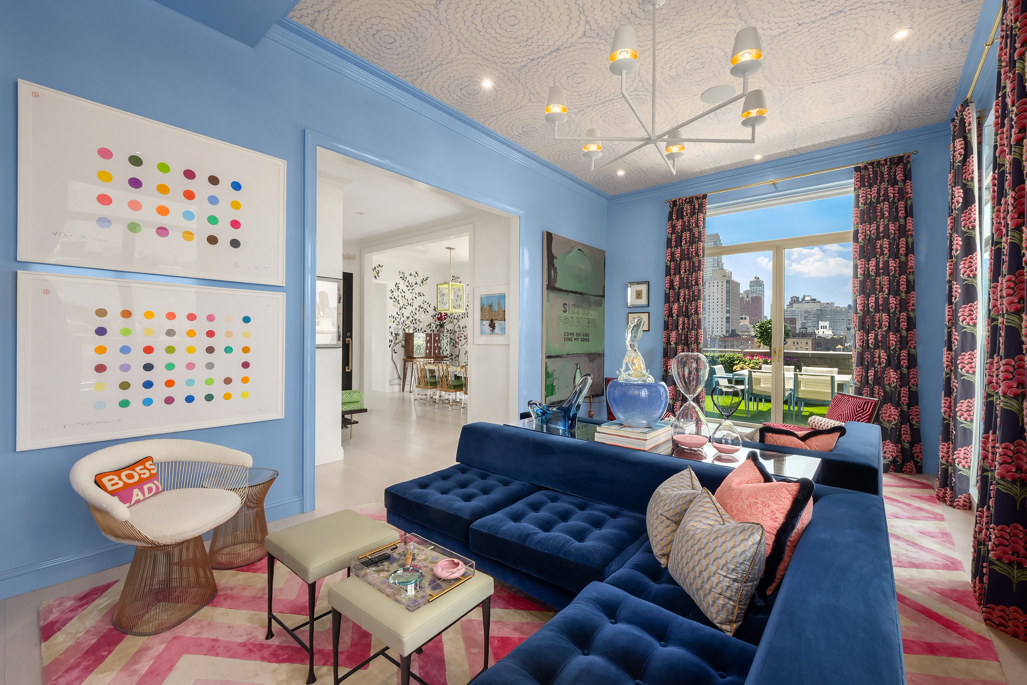 145 East 76th Street, Unit PH Manhattan, NY 10021 - Photo 3 of 19 a living room with patio furniture and a large window