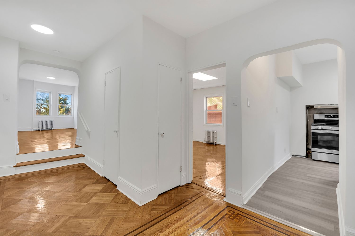 7001 Shore Road, Unit 2 Brooklyn, NY 11209 - Photo 3 of 17 wooden floor in an empty room with a window