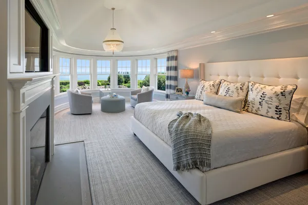 a bedroom with bed or furniture and a fireplace