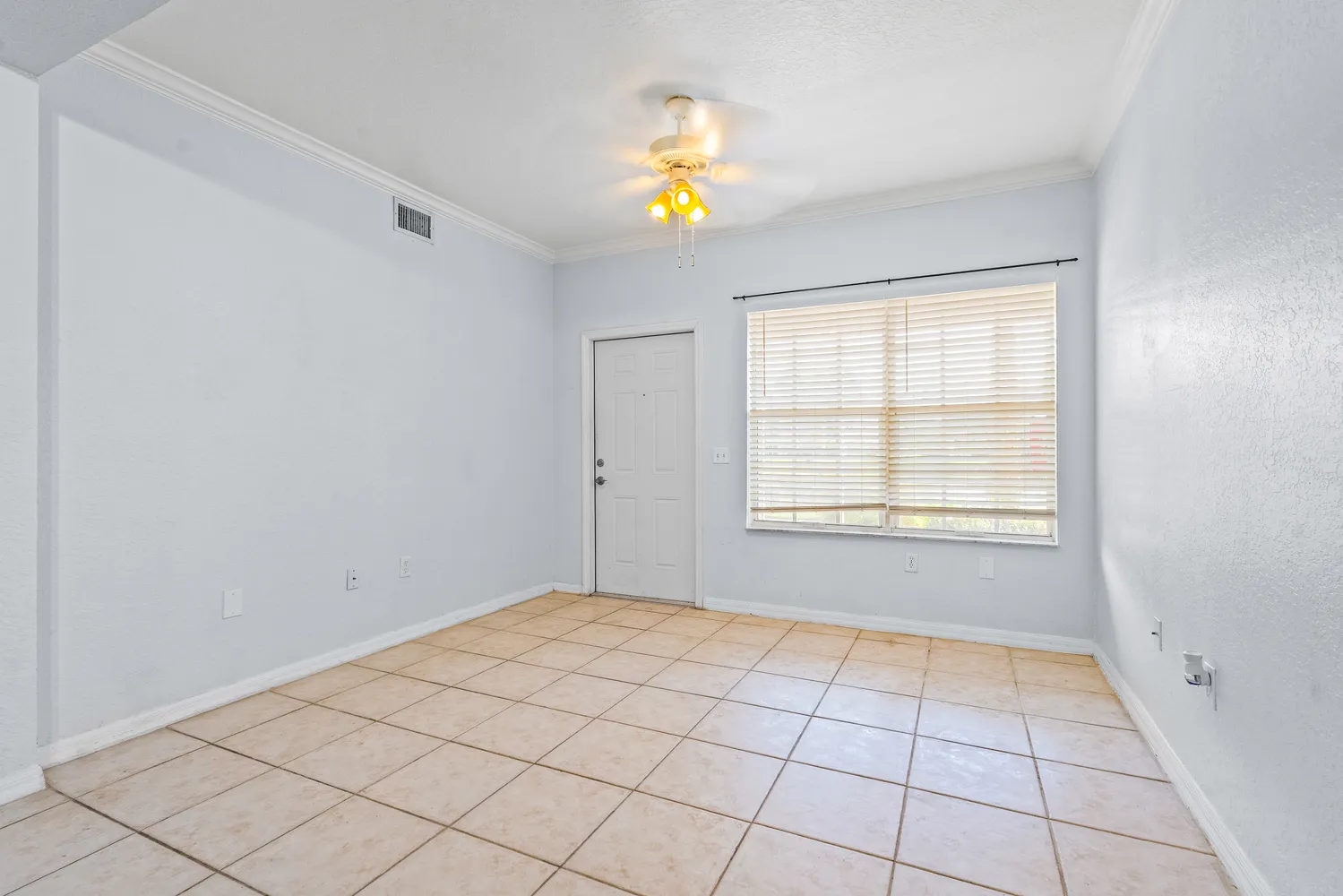 a view of an empty room and window with painted walls