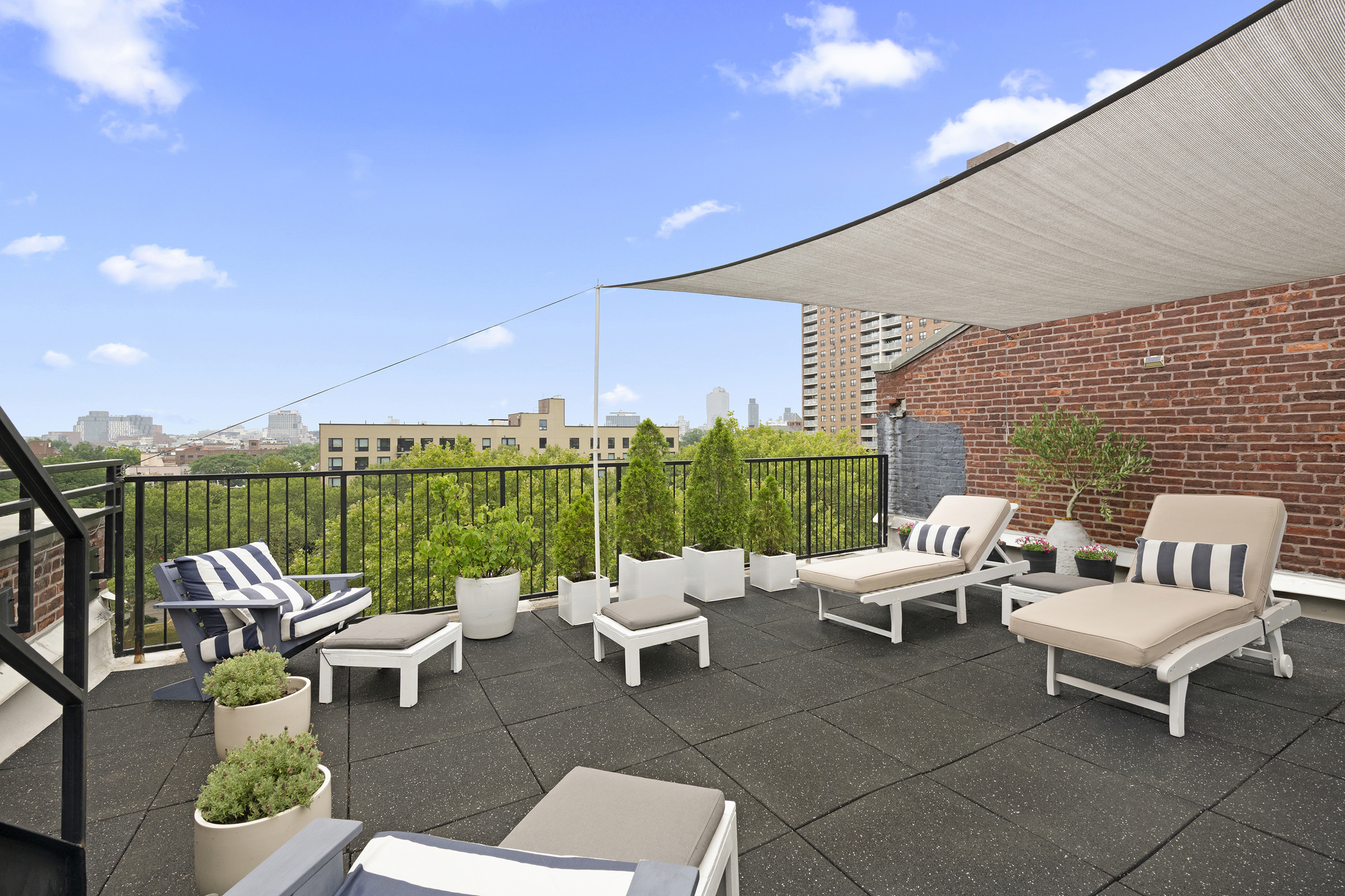 372 Dekalb Avenue, Unit 6E Brooklyn, NY 11205 - Photo 13 of 16 a roof deck with couches and potted plants