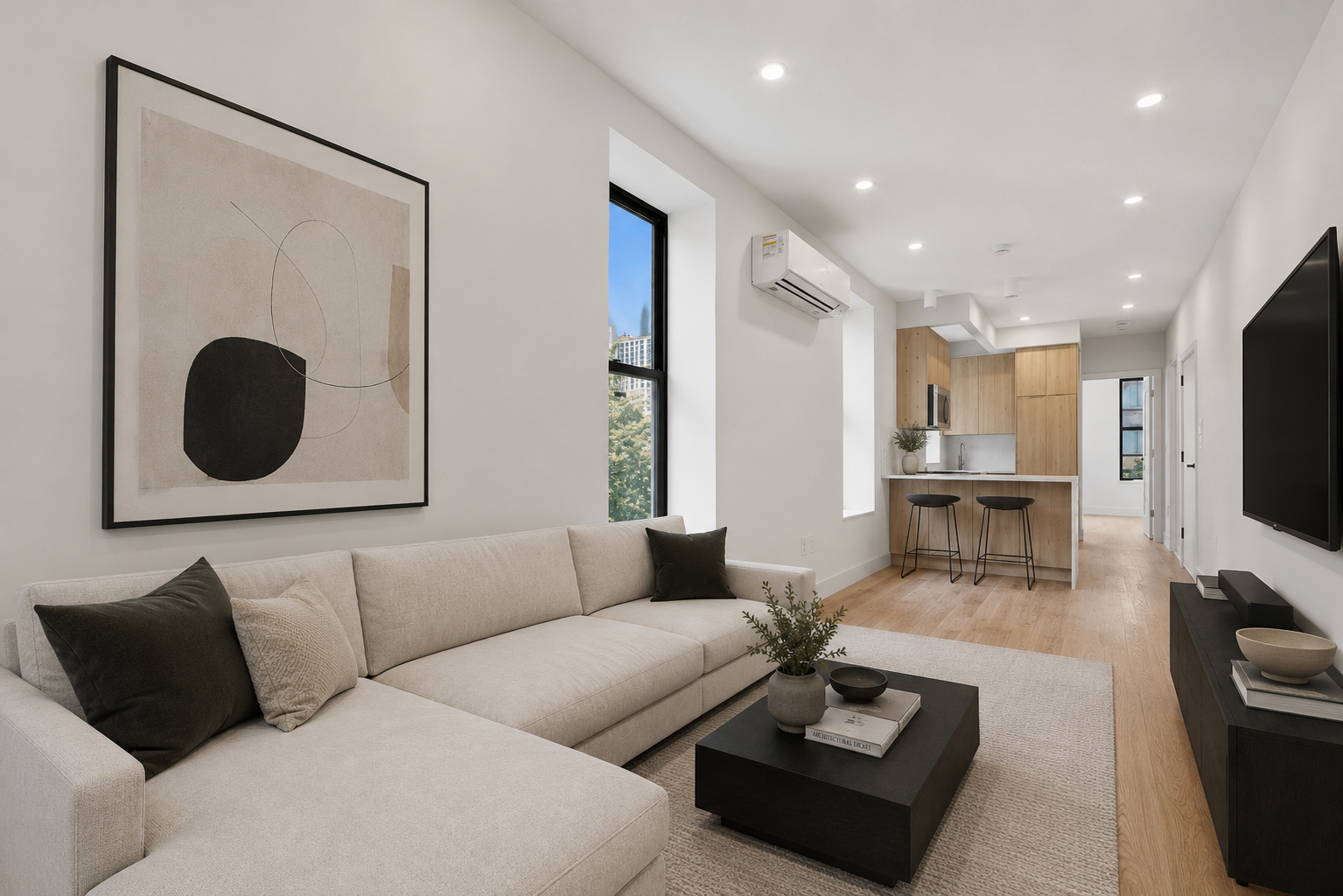 1739 2nd Avenue, Unit PH Manhattan, NY 10128 - Photo 3 of 13 a living room with furniture and a flat screen tv