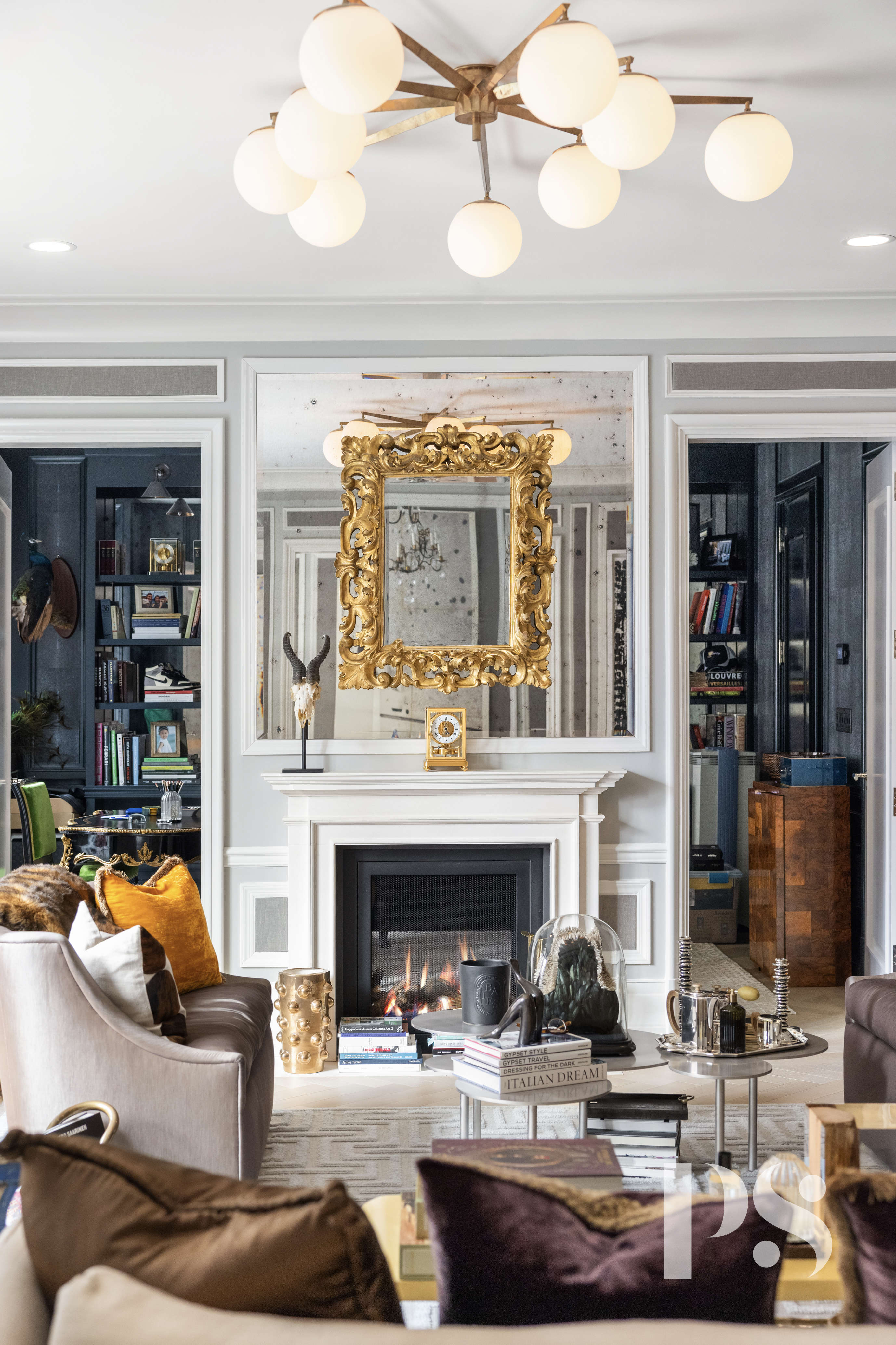 135 East 79th Street, Unit 8E Manhattan, NY 10075 - Photo 2 of 26 a living room with furniture and a fireplace