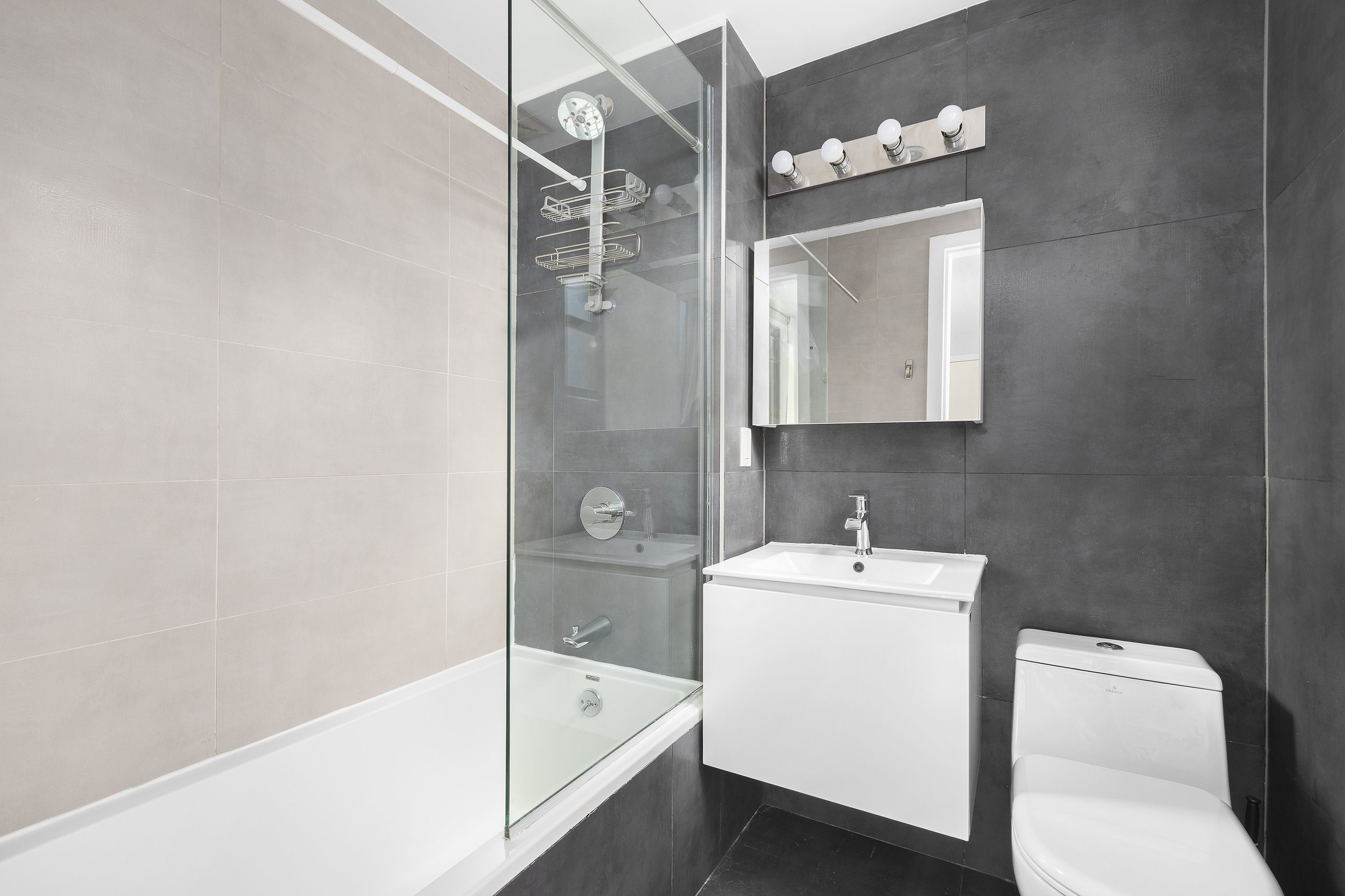 364 Lafayette Avenue, Unit 4A Brooklyn, NY 11238 - Photo 9 of 12 a bathroom with a sink toilet and shower