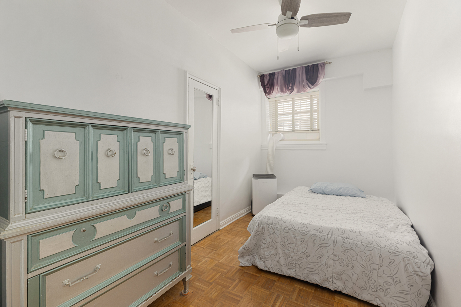 400 Riverside Drive, Unit K Manhattan, NY 10025 - Photo 19 of 22 a bedroom with a large bed and ceiling fan