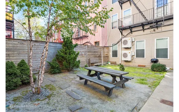 a view of a bench in a patio