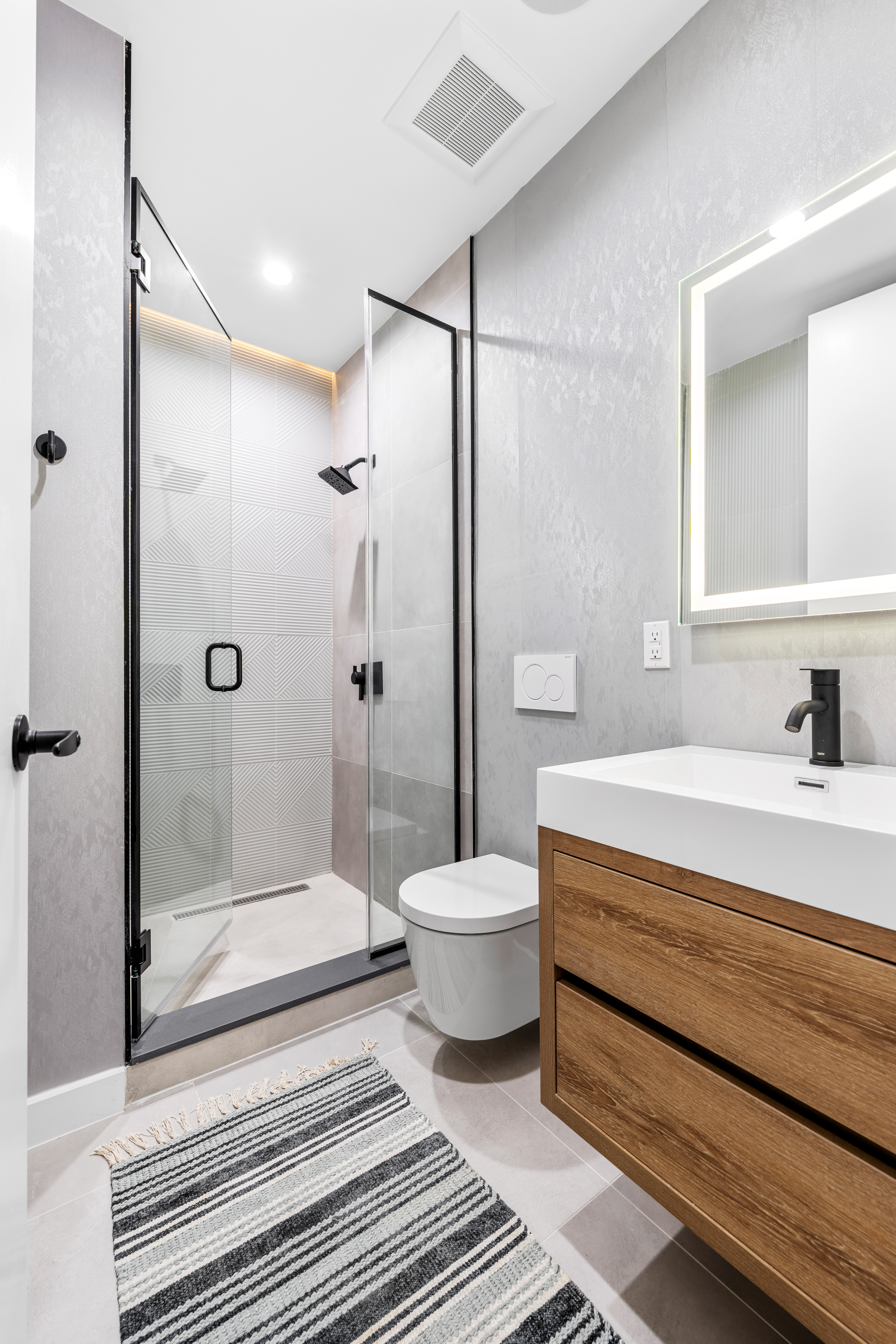 545 Lexington Avenue, Unit 1 Brooklyn, NY 11221 - Photo 11 of 19 a bathroom with a toilet a sink and shower