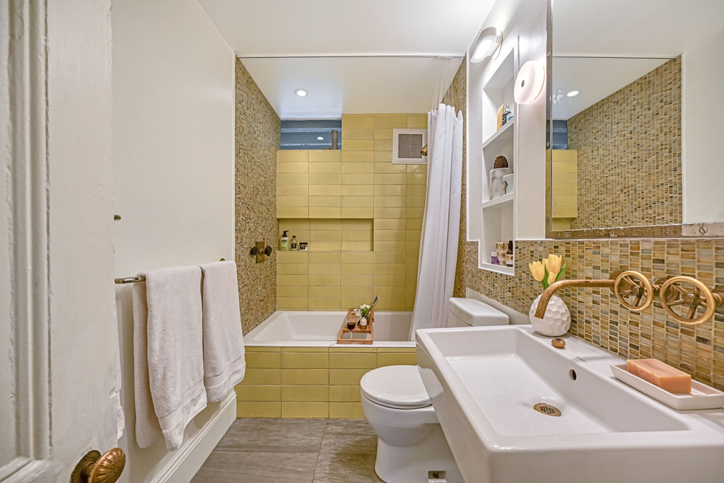 315 15th Street Brooklyn, NY 11215 - Photo 11 of 25 a bathroom with a sink a toilet and shower