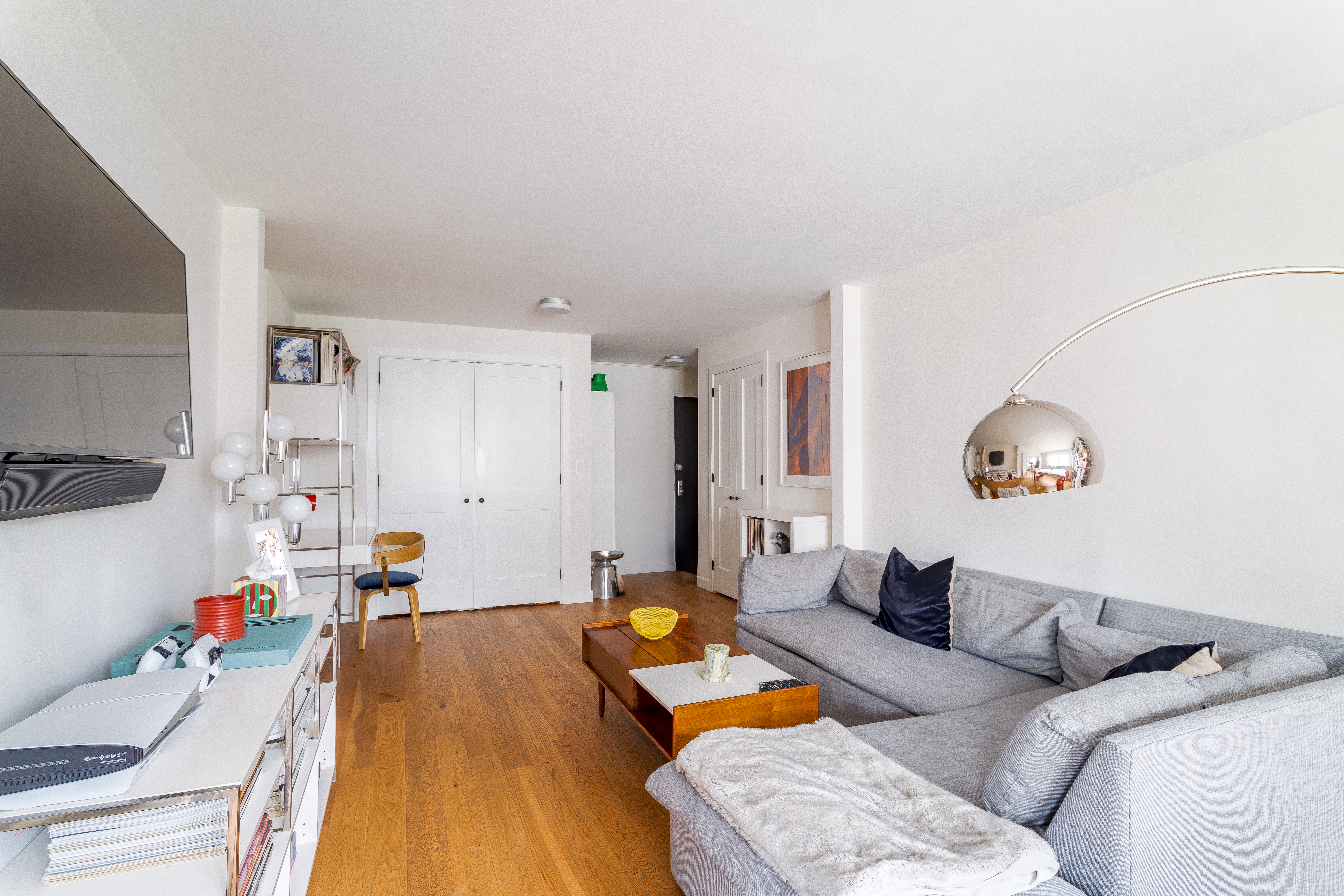 191 Willoughby Street, Unit 12J Brooklyn, NY 11201 - Photo 4 of 19 a bedroom with furniture and a wooden floor