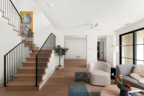 a view of entryway and hall with wooden floor