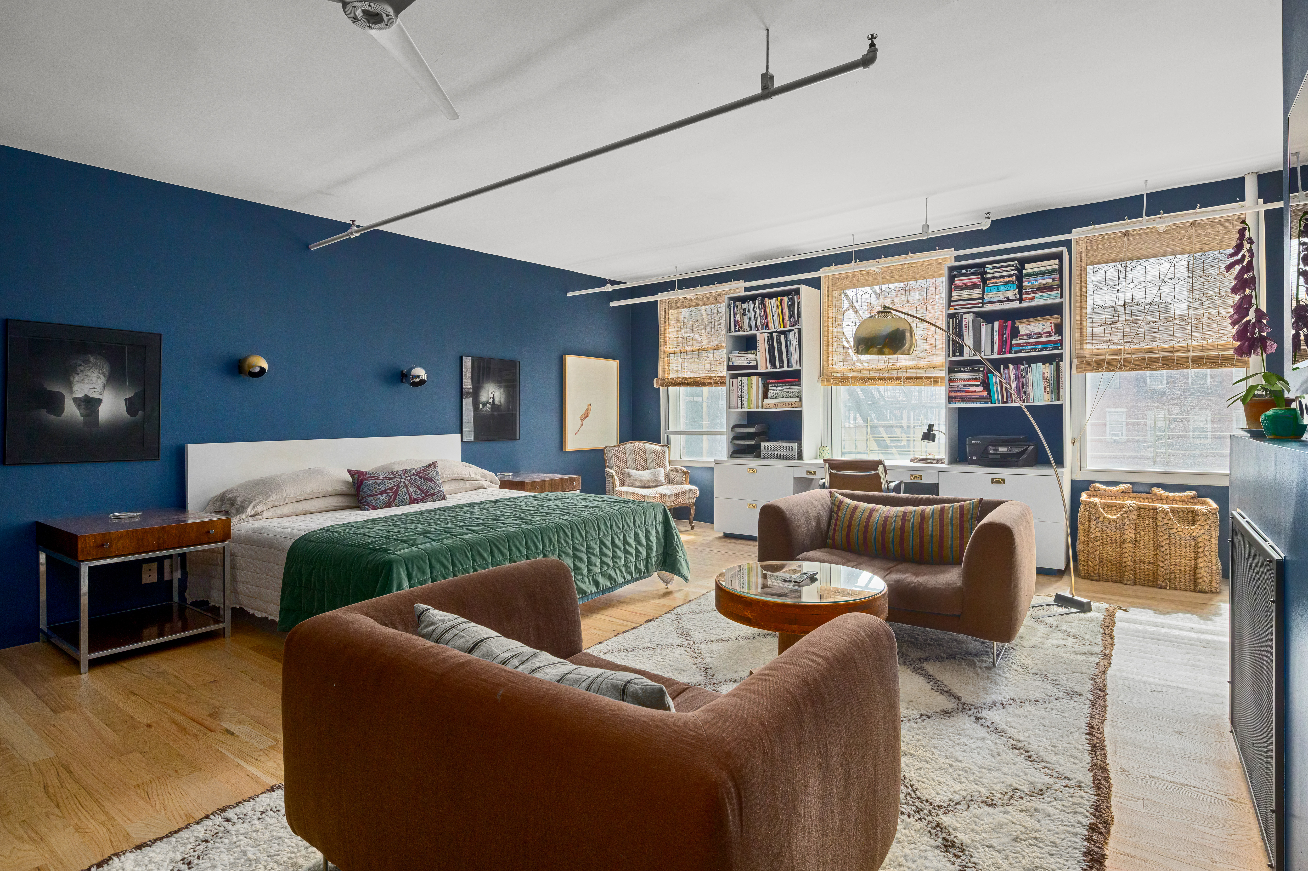 191 Chrystie Street, Unit 5R Manhattan, NY 10002 - Photo 7 of 16 a living room with furniture and a flat screen tv