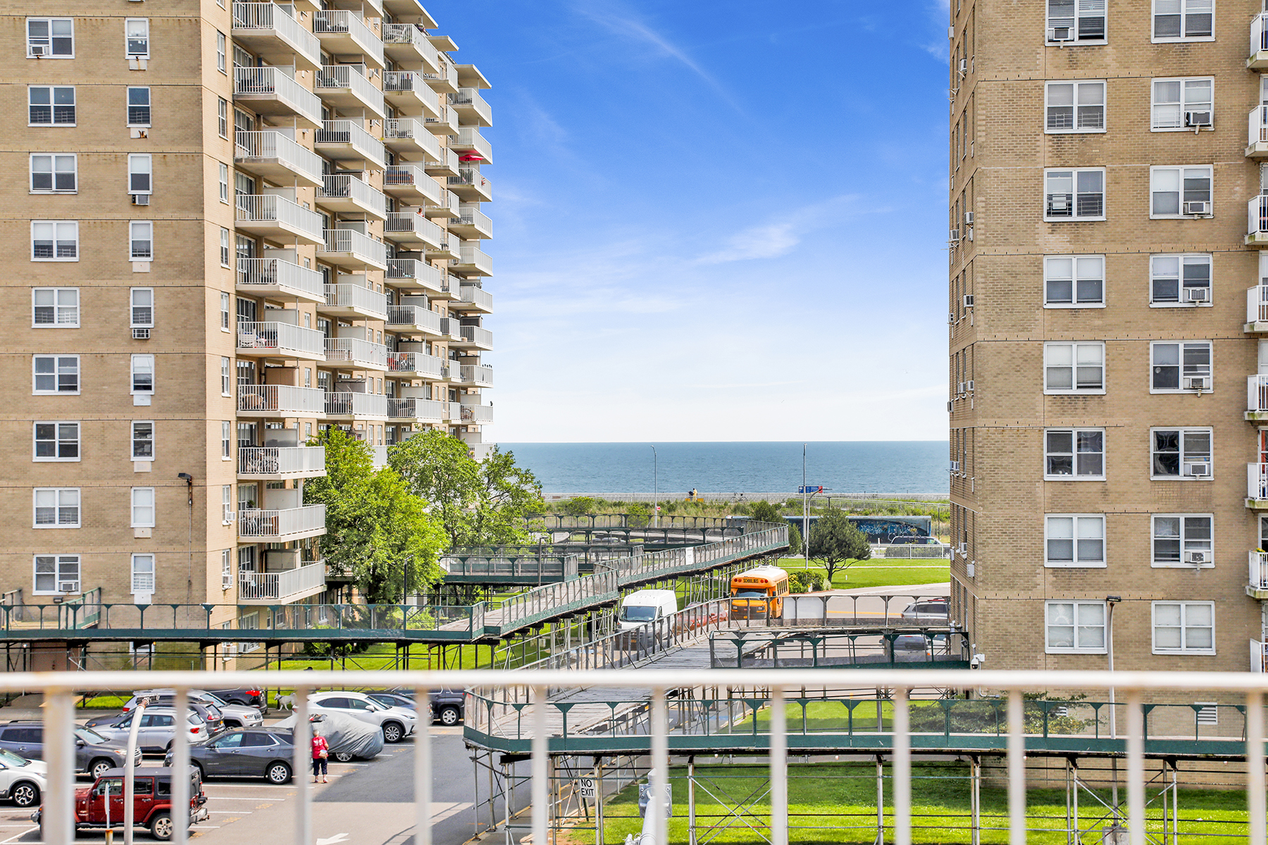 102-20 Rockaway Beach Boulevard, Unit 3C Queens, NY 11694 - Photo 31 of 36 a view of building with outdoor space swimming pool and outdoor seating