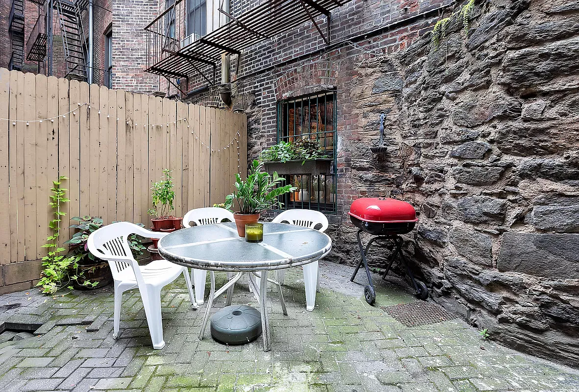 949 Columbus Avenue, Unit 1 Manhattan, NY 10025 - Photo 2 of 6 a view of a chairs and table in patio