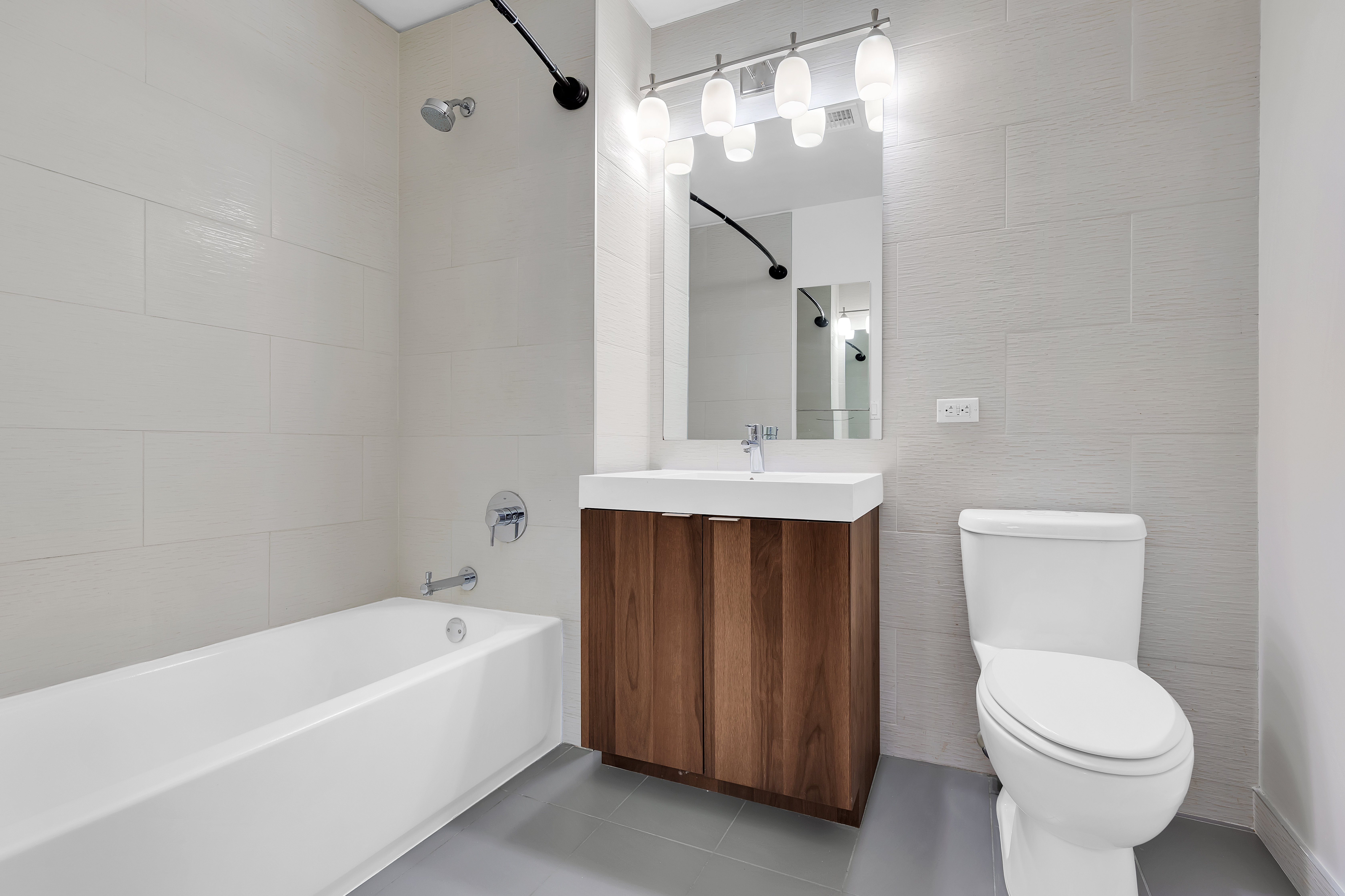 8 Vanderbilt Avenue, Unit 4D Brooklyn, NY 11205 - Photo 4 of 8 a bathroom with a sink a toilet and shower