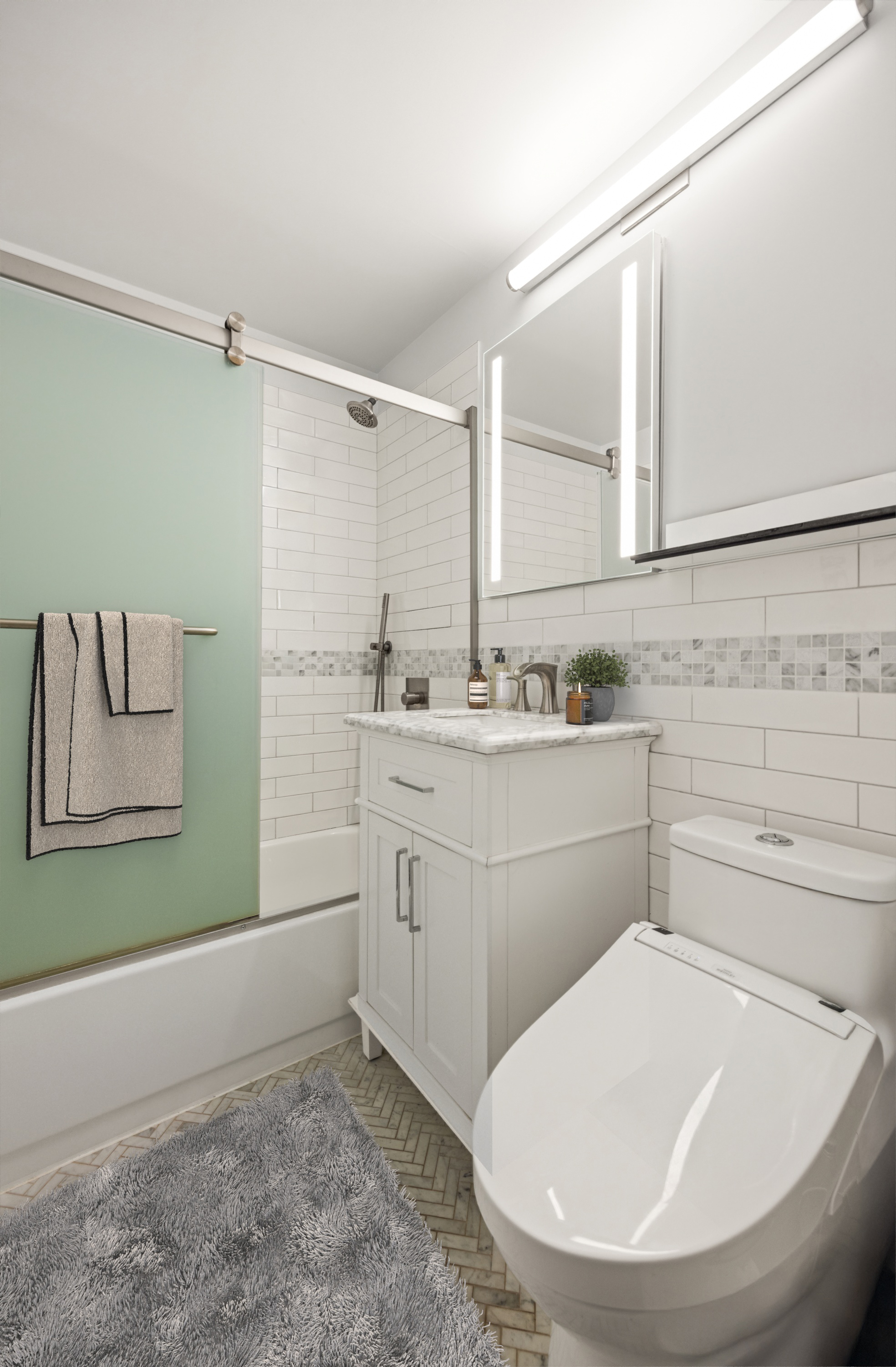 45 West 54th Street, Unit 9E Manhattan, NY 10019 - Photo 5 of 9 a room with a washer and dryer