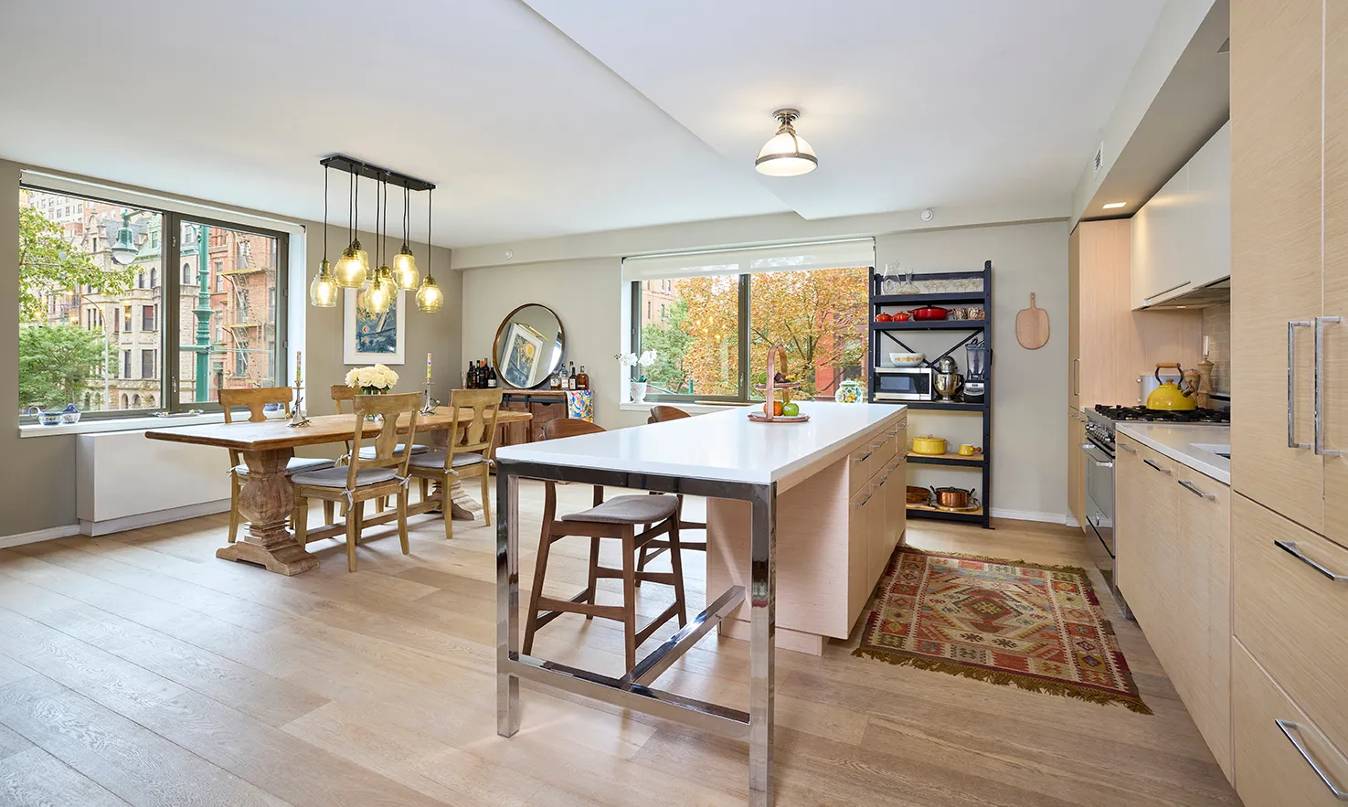 a large kitchen with a table and chairs