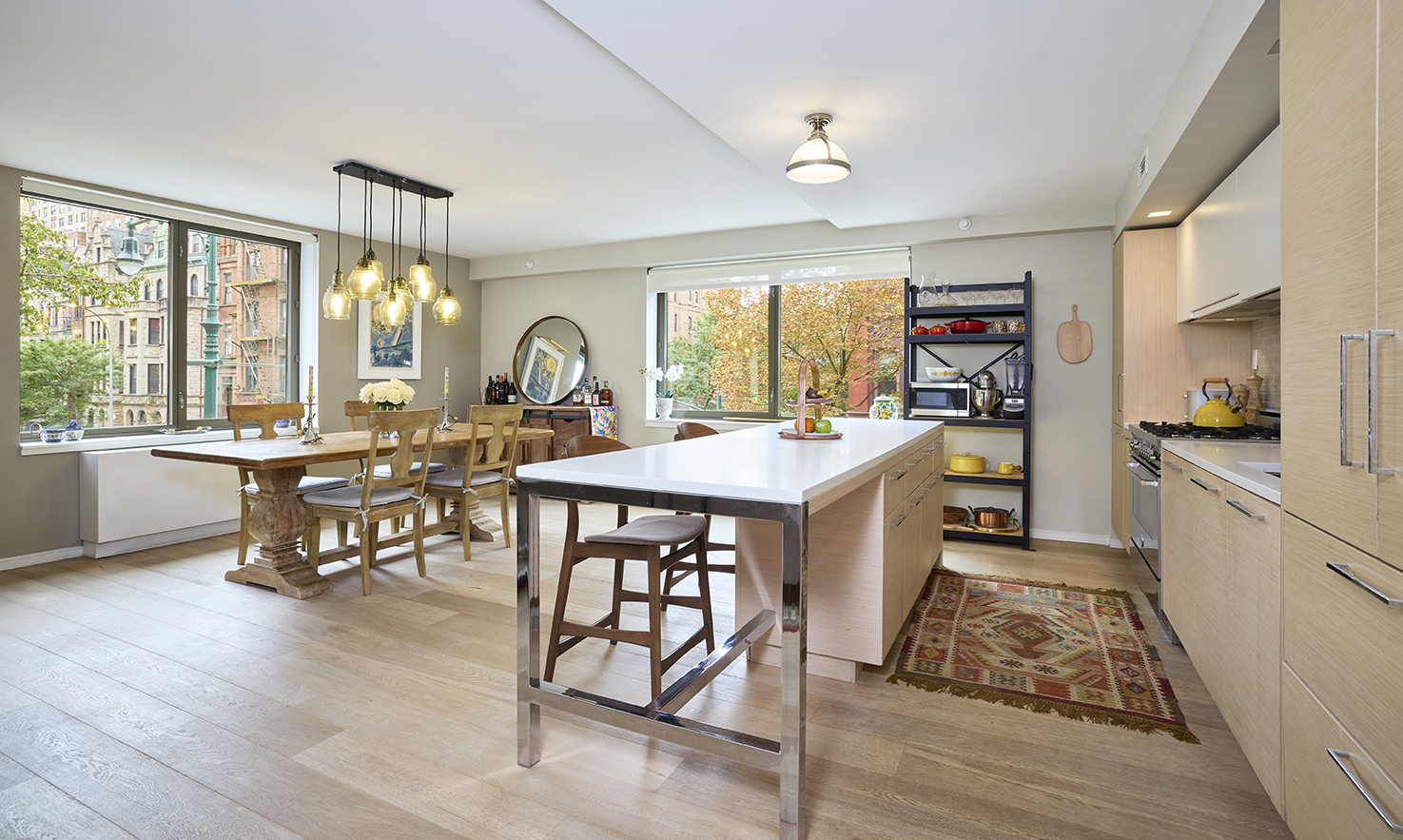 101 West 87th Street, Unit 205 Manhattan, NY 10024 - Photo 1 of 14 a large kitchen with a table and chairs