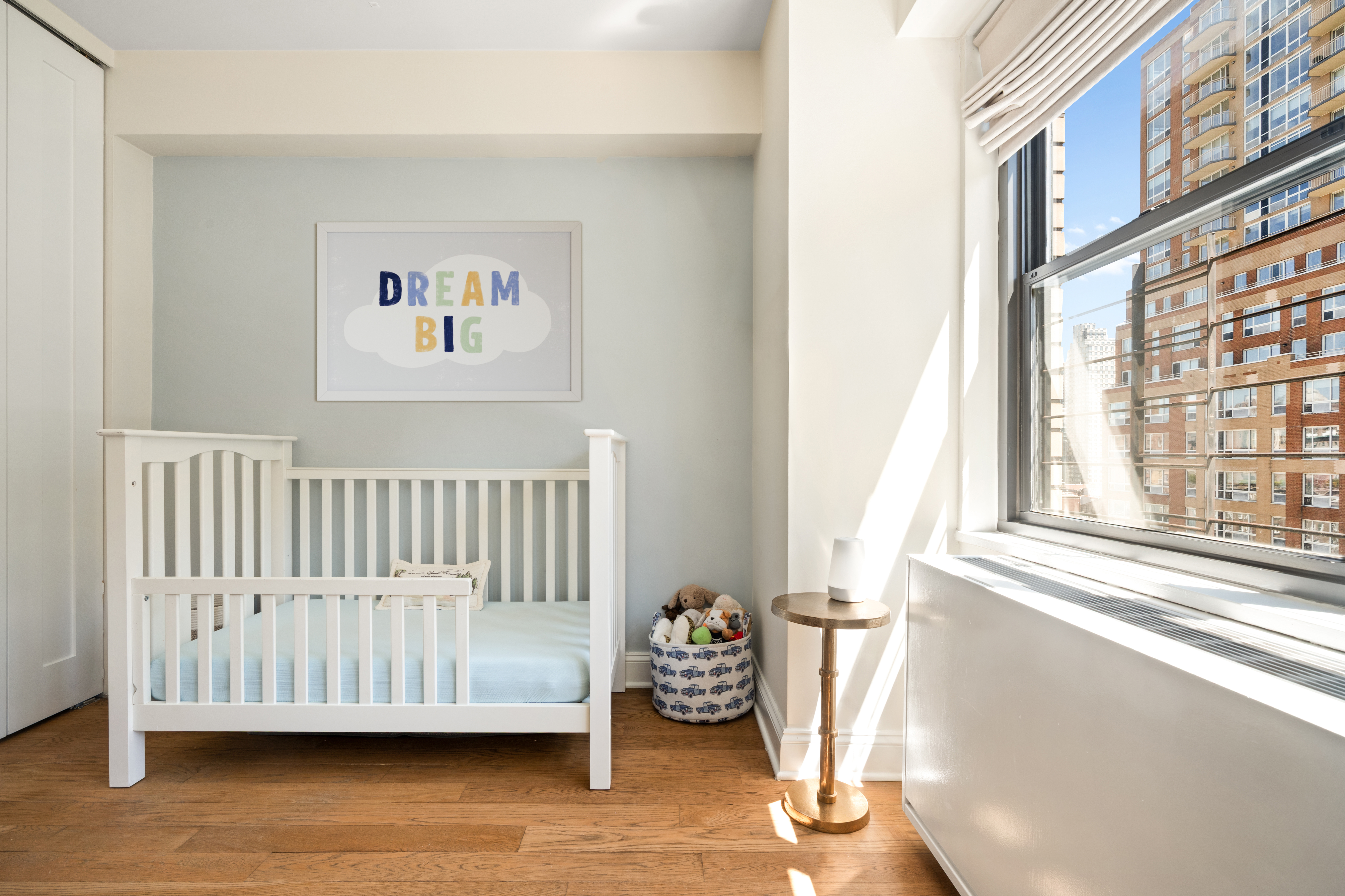 178 East 80th Street, Unit 15C Manhattan, NY 10075 - Photo 6 of 12 a view of a bedroom with wooden floor and a window