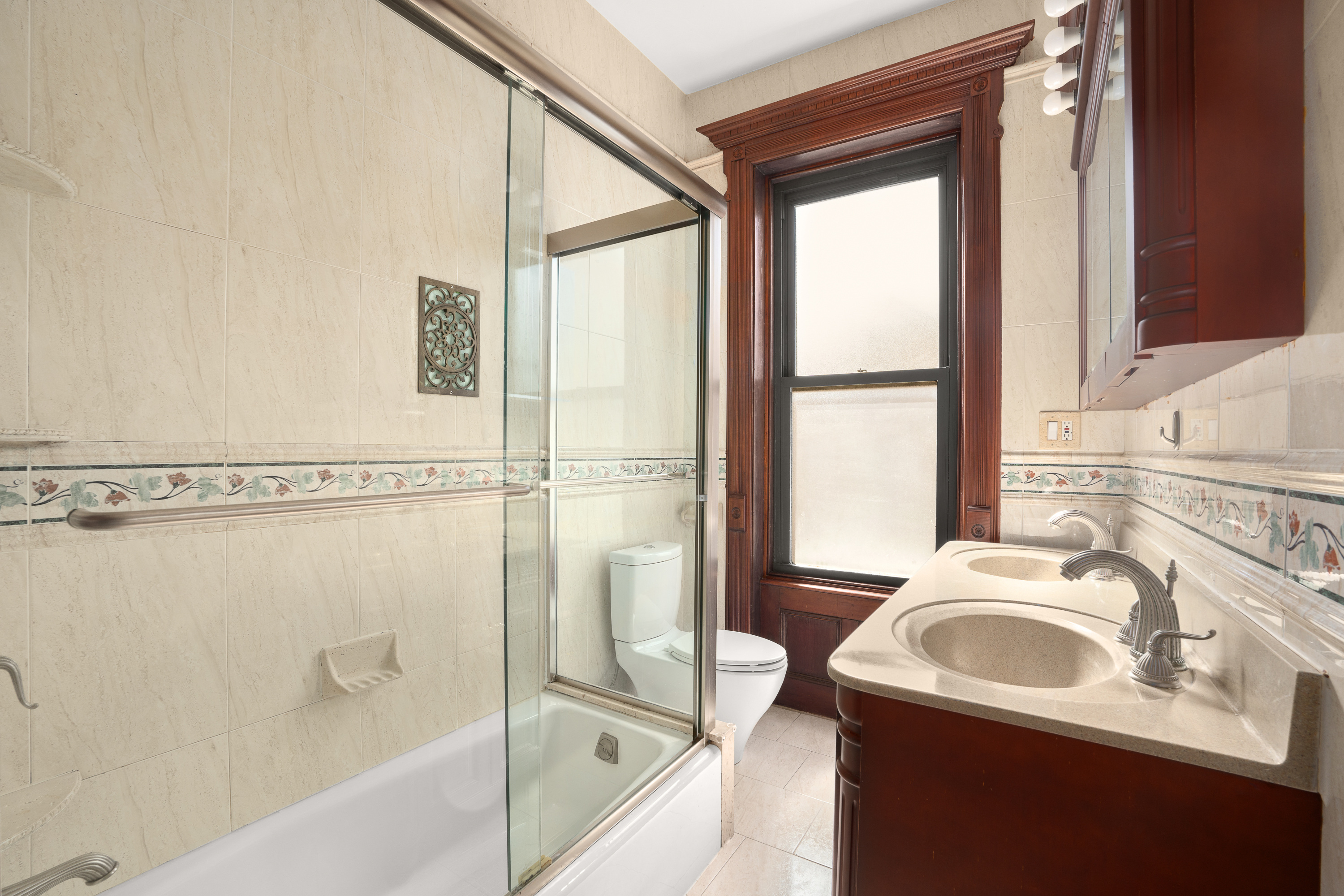 420 8th Street Brooklyn, NY 11215 - Photo 9 of 20 a bathroom with a sink a bathtub and a shower