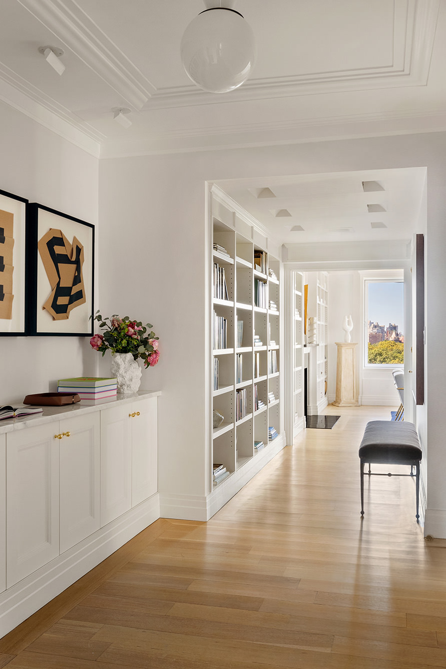 969 5th Avenue, Unit 14 Manhattan, NY 10075 - Photo 4 of 17 a view of a livingroom with wooden floor and cabinet