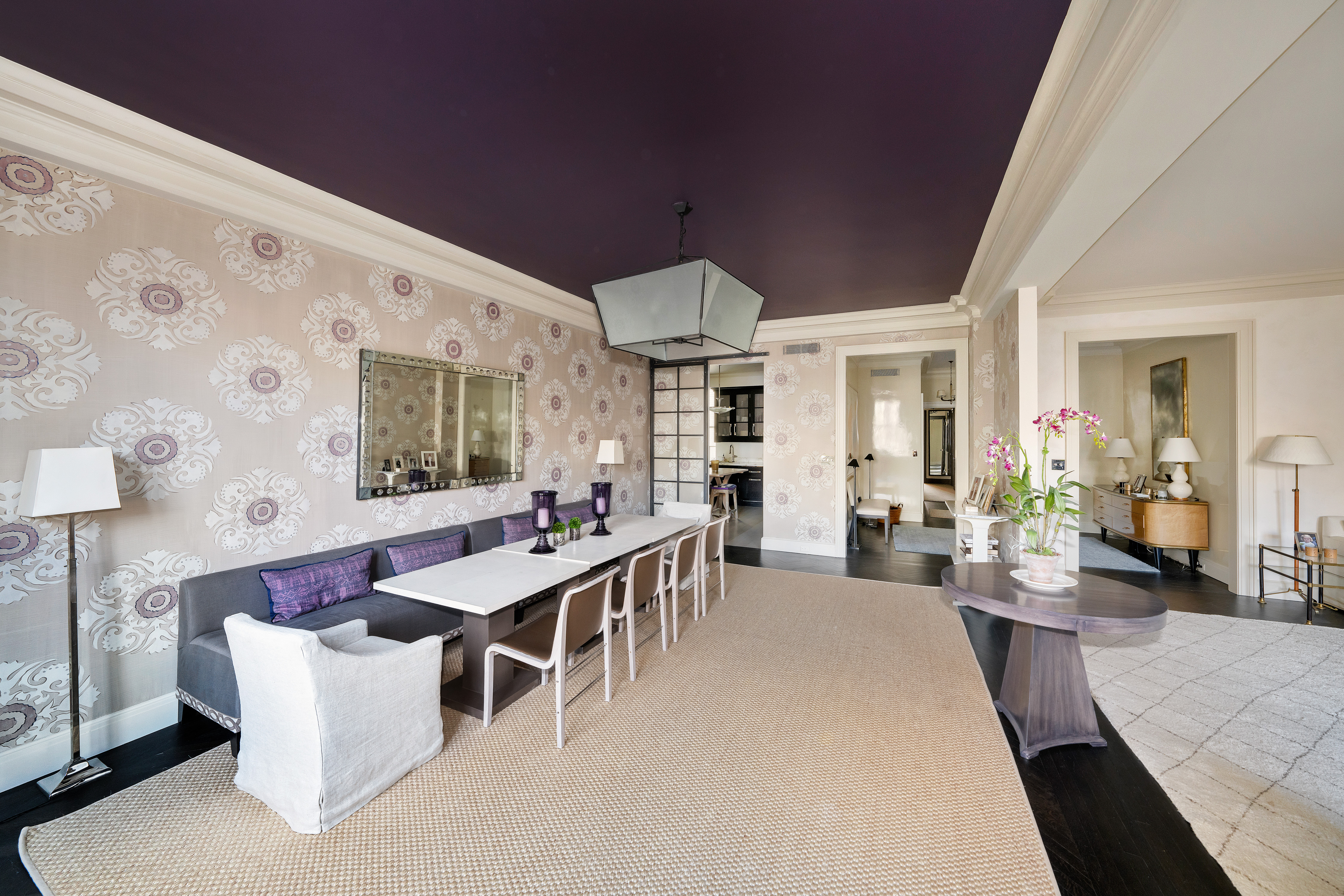 850 Park Avenue, Unit 9C Manhattan, NY 10075 - Photo 4 of 14 a large living room with stainless steel appliances kitchen island granite countertop furniture and a large window