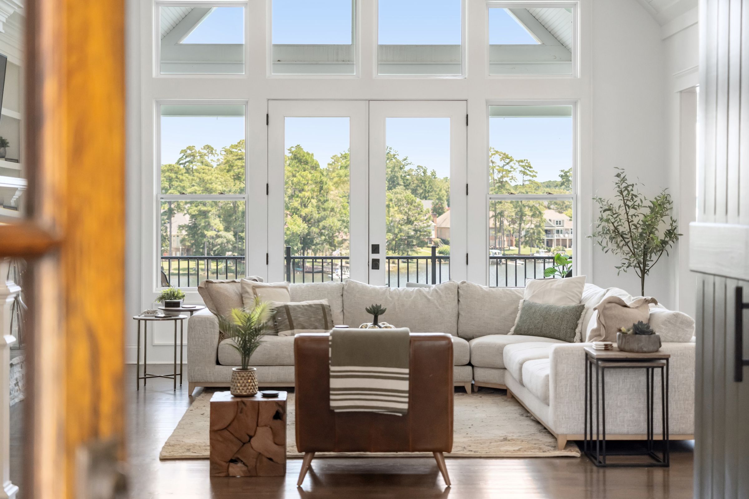 249 Pointe Overlook Drive Chapin, SC 29036 - Photo 9 of 56 a living room with furniture and floor to ceiling windows