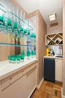 a kitchen with stainless steel appliances granite countertop a stove and a wooden cabinets