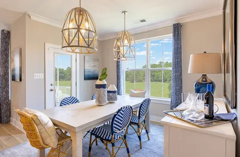 a dining room view with a table and chairs