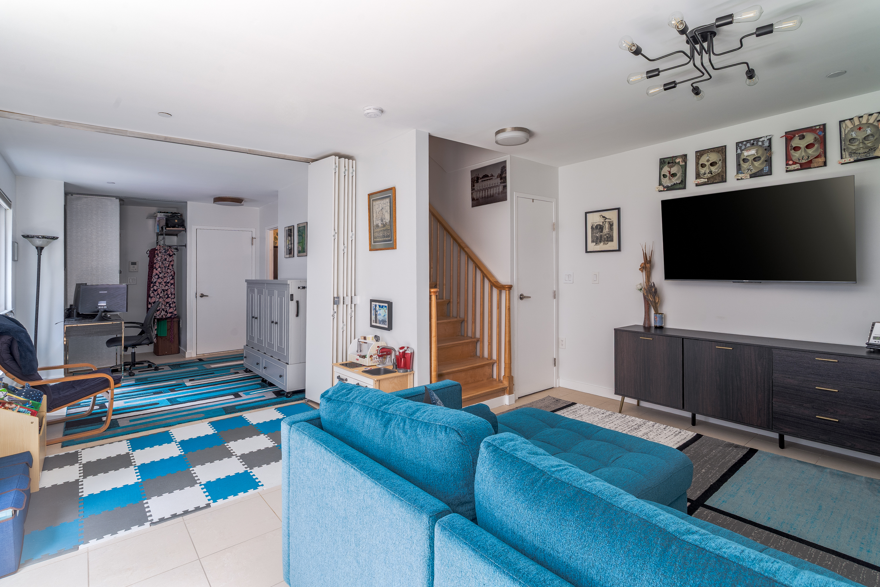 560 Carroll Street, Unit 1D Brooklyn, NY 11215 - Photo 13 of 19 a living room with furniture and a flat screen tv