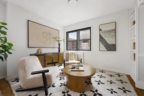 a living room with furniture and window