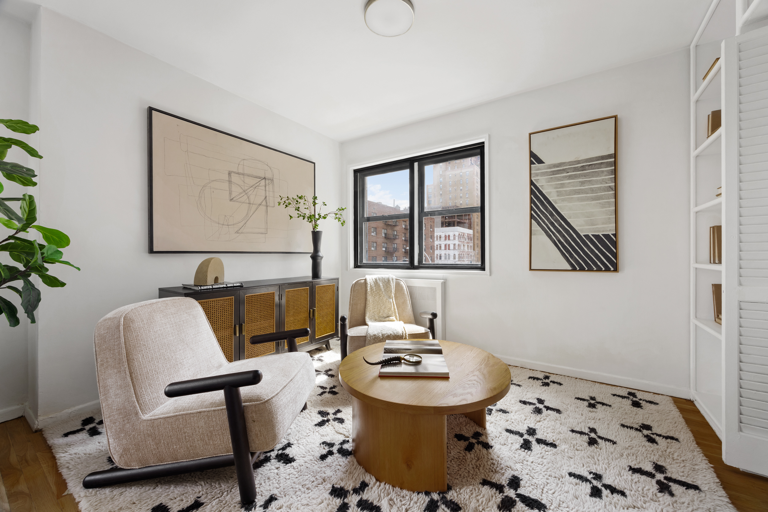 140 7th Avenue, Unit 4L Manhattan, NY 10011 - Photo 4 of 14 a living room with furniture and window