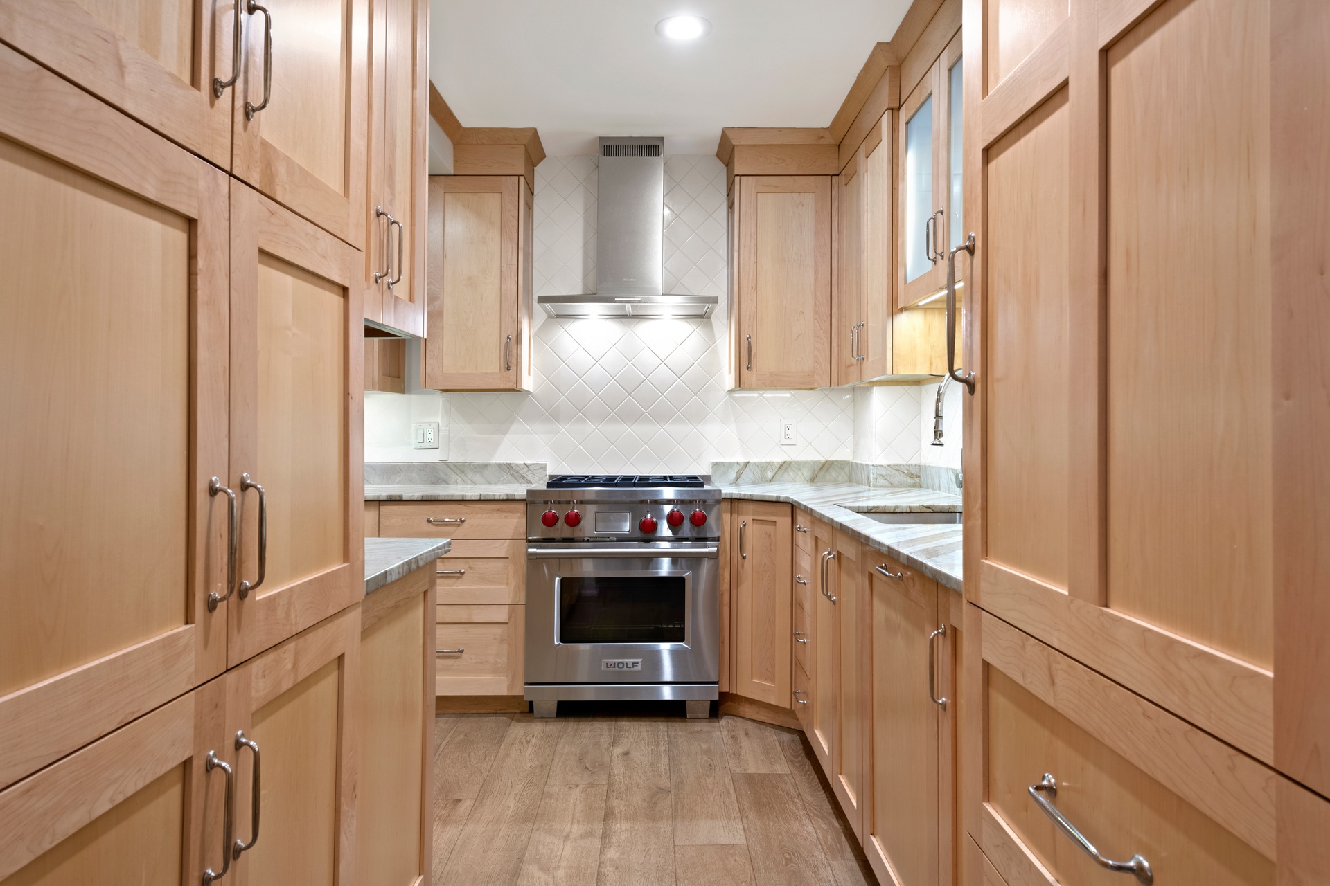 440 East 57th Street, Unit 1G Manhattan, NY 10022 - Photo 2 of 10 a kitchen with stainless steel appliances a stove and a refrigerator